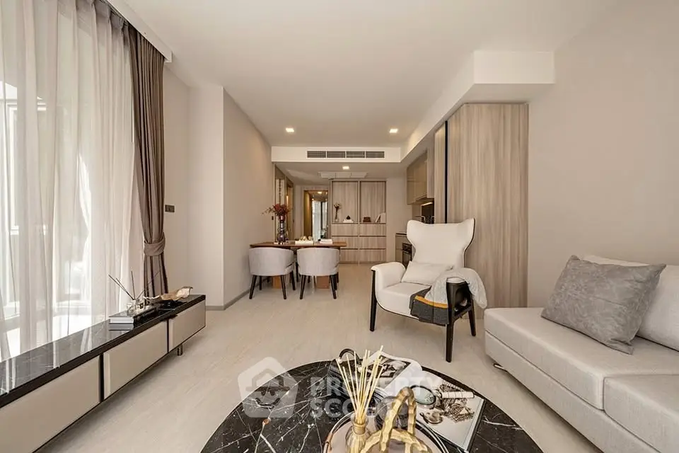Spacious modern living room with elegant decor and open layout, perfect for relaxation and entertaining.
