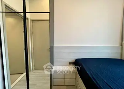 Modern bedroom with mirrored wardrobe and sleek design