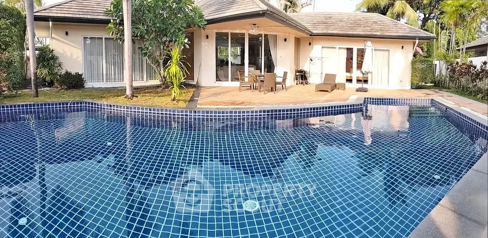 Luxurious villa with private pool and spacious patio in tropical setting