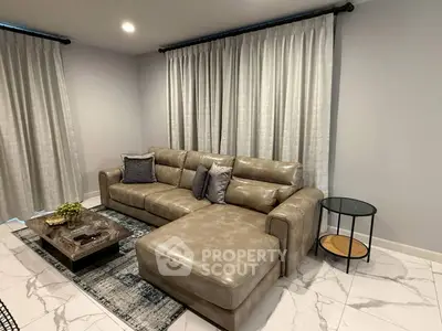 Modern living room with stylish leather sectional sofa and elegant decor