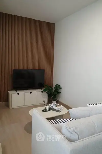 Modern living room with stylish decor and TV setup