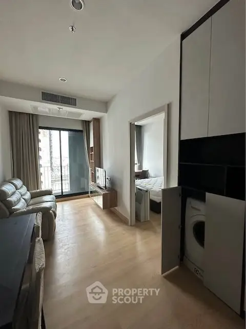Modern apartment living room with balcony and washing machine