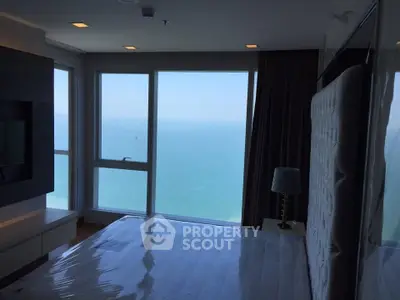 Luxurious bedroom with stunning ocean view and modern decor