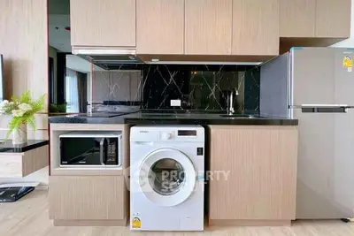 Modern kitchen with sleek appliances and stylish cabinetry
