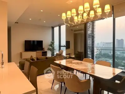 Luxurious modern living room with elegant dining area and stunning city view from balcony.