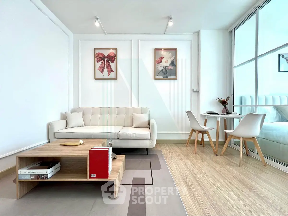 Modern living room with elegant decor and cozy dining area, featuring stylish furniture and bright natural lighting.