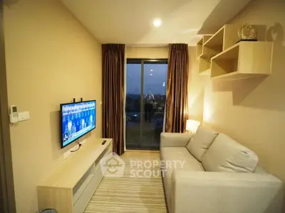 Cozy living room with modern decor and balcony view