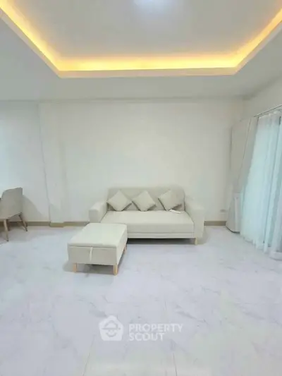 Modern living room with elegant white sofa and minimalist decor