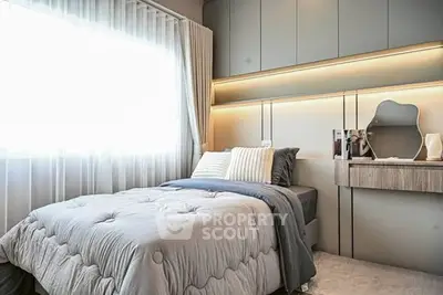 Modern bedroom with stylish decor and natural light