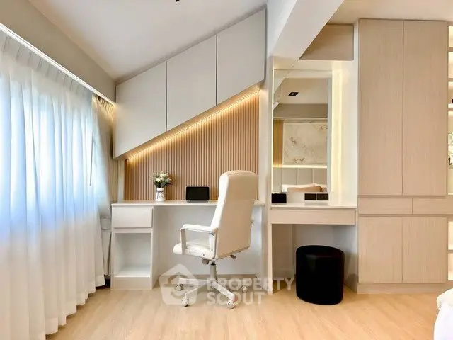 Modern study room with sleek desk, ergonomic chair, and ample storage in a bright, airy space.