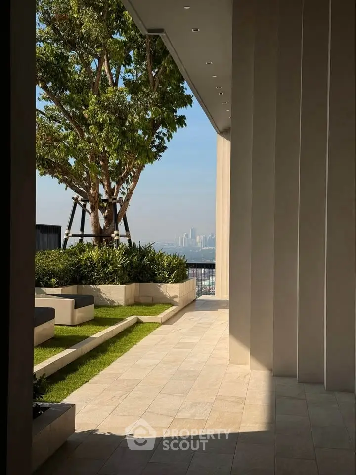 Stunning garden terrace with city skyline view, perfect for relaxation and entertainment.