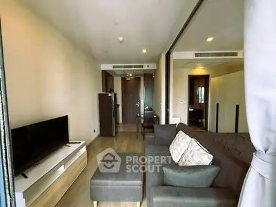 Modern living room with sleek furniture and open layout in a stylish apartment.