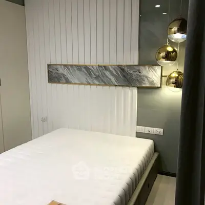 Modern bedroom with stylish lighting and elegant decor