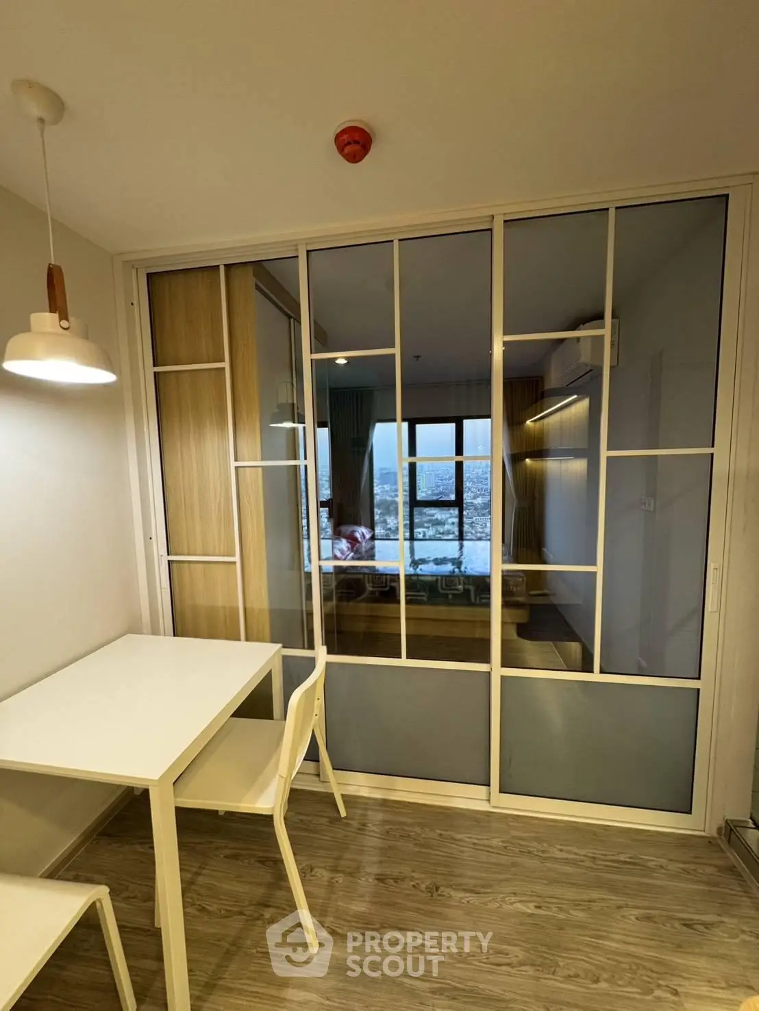Modern apartment with sliding glass doors and stylish dining area