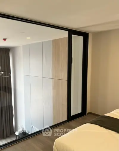 Modern bedroom with glass wall and minimalist design