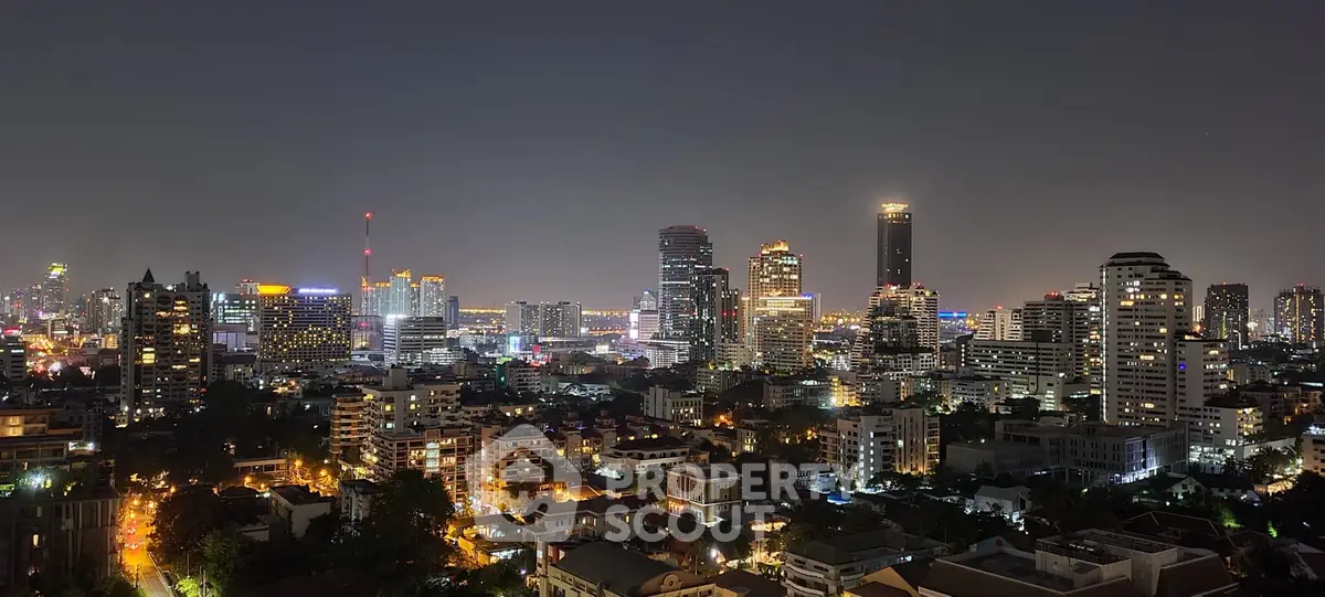 Stunning night cityscape view showcasing vibrant urban skyline with illuminated skyscrapers and residential buildings.