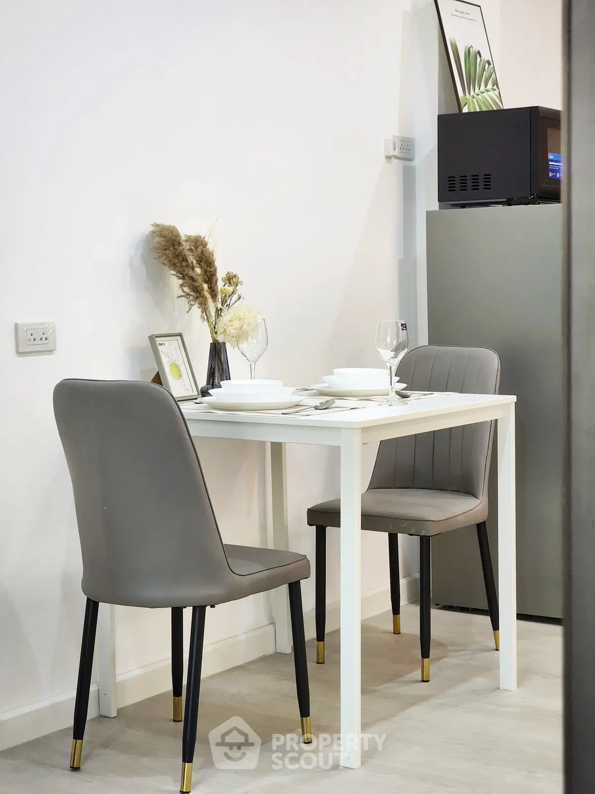 Modern dining area with elegant table setting and stylish chairs