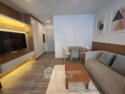 Modern living room with stylish decor, cozy sofa, and entertainment setup for ultimate relaxation.