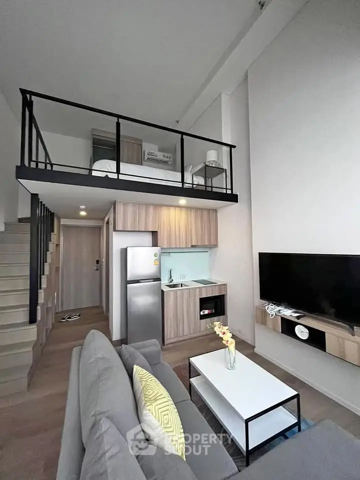 Modern loft apartment with open living area and mezzanine bedroom