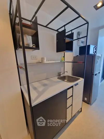 Modern compact kitchen with sleek design and open shelving