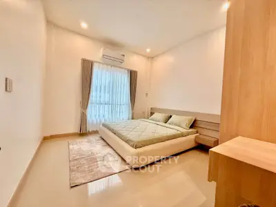 Spacious modern bedroom with natural light and minimalist design