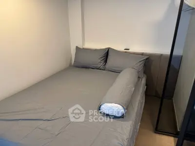 Cozy bedroom with modern gray bedding and minimalist design