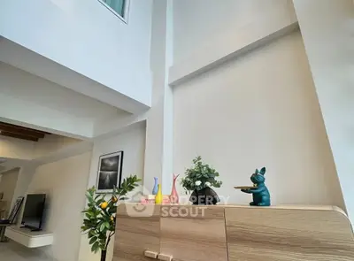 Modern living room with high ceiling and stylish decor