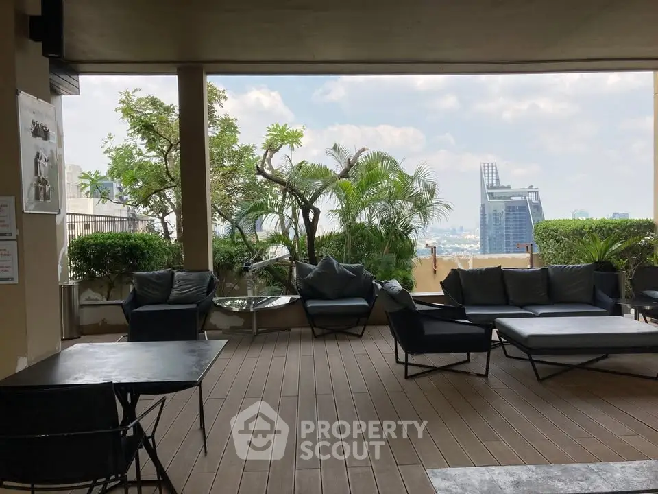 Luxurious rooftop terrace with stunning city view and modern outdoor seating.