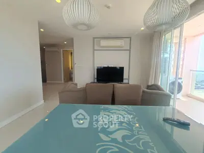 Modern living room with stylish lighting and glass table in a cozy apartment