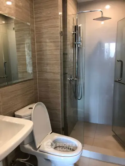 Modern bathroom with glass shower and sleek fixtures