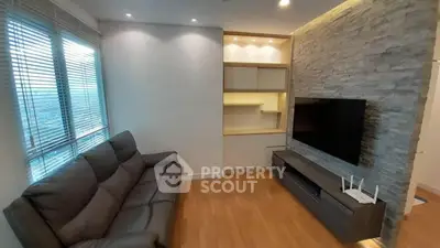 Modern living room with sleek sofa and built-in entertainment unit