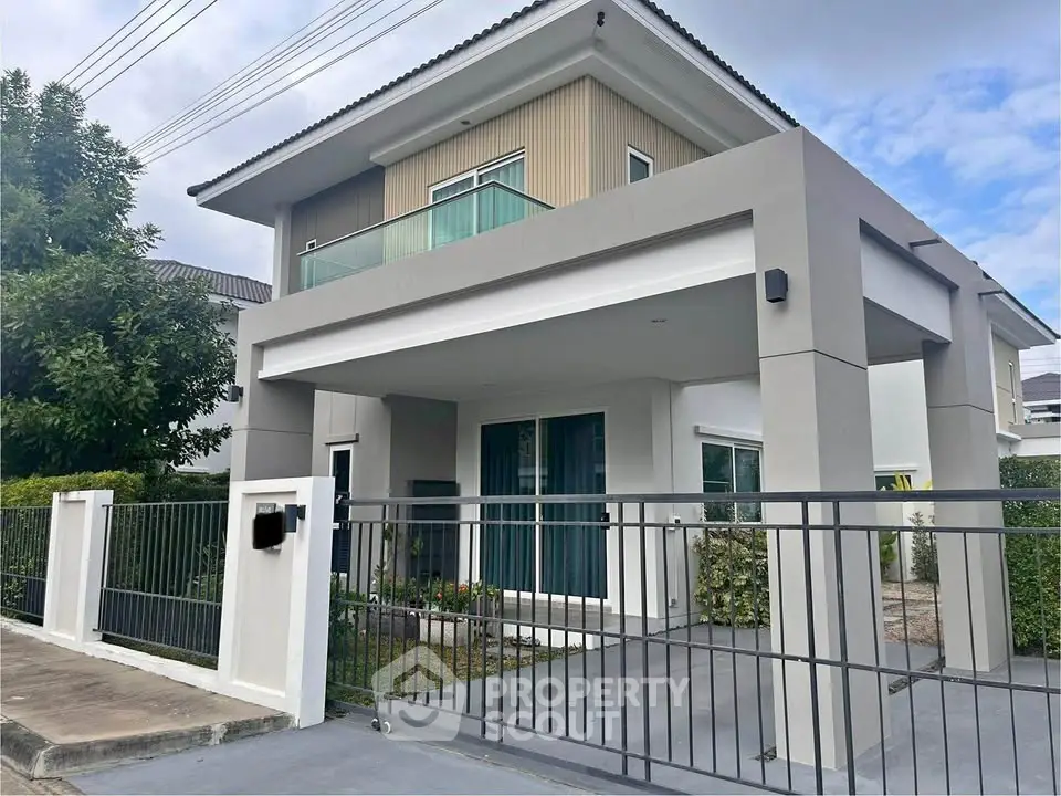 Modern two-story house with sleek design and spacious balcony
