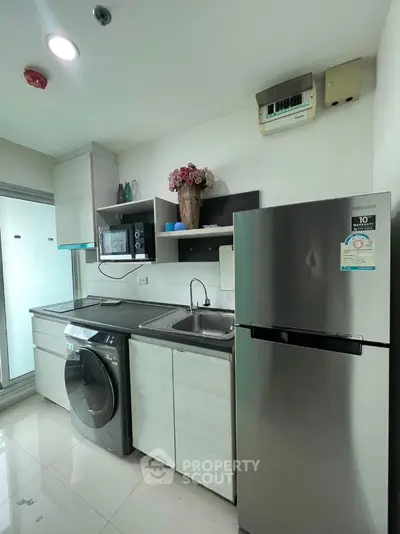 Modern kitchen with stainless steel appliances and sleek cabinetry