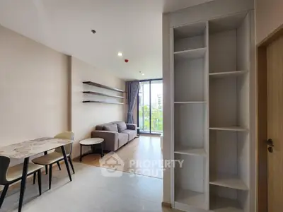 Modern living room with open layout and balcony view in a stylish apartment
