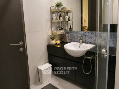 Modern bathroom with sleek sink and stylish shelving