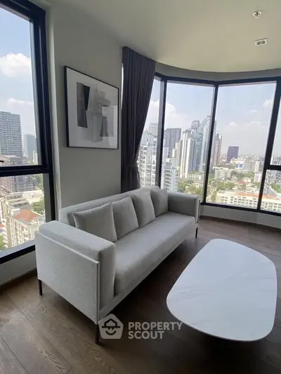Modern living room with panoramic city view and stylish furniture