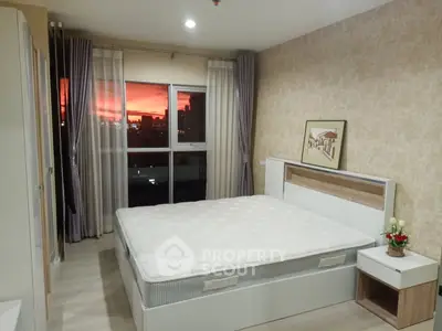 Spacious bedroom with sunset view, modern decor, and large windows in a stylish apartment.