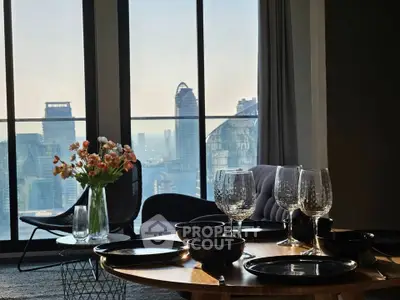 Luxurious living room with stunning city view, elegant decor, and modern furnishings.