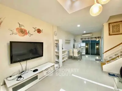 Spacious modern living room with elegant decor and open layout, perfect for family gatherings.