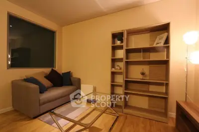 Cozy living room with modern sofa and stylish bookshelf