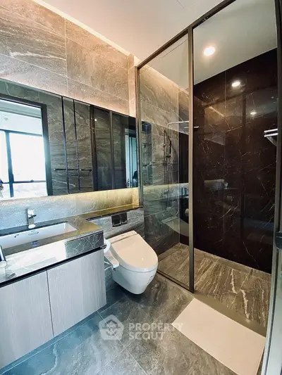 Luxurious modern bathroom with sleek design and glass shower enclosure