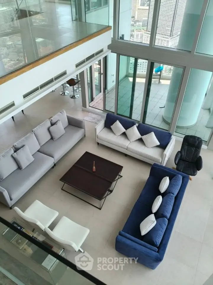 Luxurious modern living room with panoramic city views and stylish furniture
