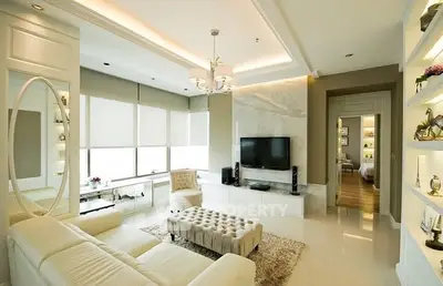 Luxurious modern living room with elegant decor and ample natural light.