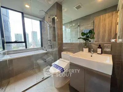 Modern bathroom with city view, featuring glass shower and sleek fixtures.
