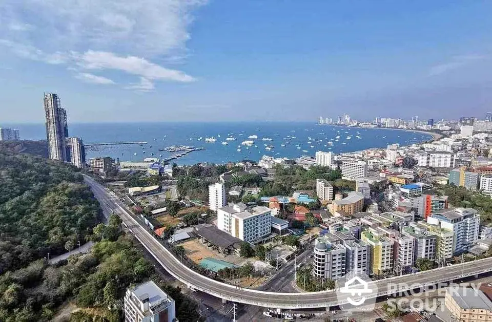 Stunning coastal cityscape with ocean view and modern high-rise buildings