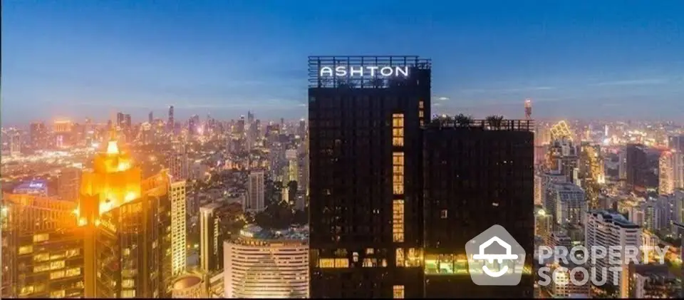 Stunning cityscape view from high-rise building at dusk with vibrant city lights.