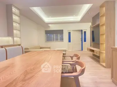 Spacious modern living room with elegant wooden furniture and ambient lighting