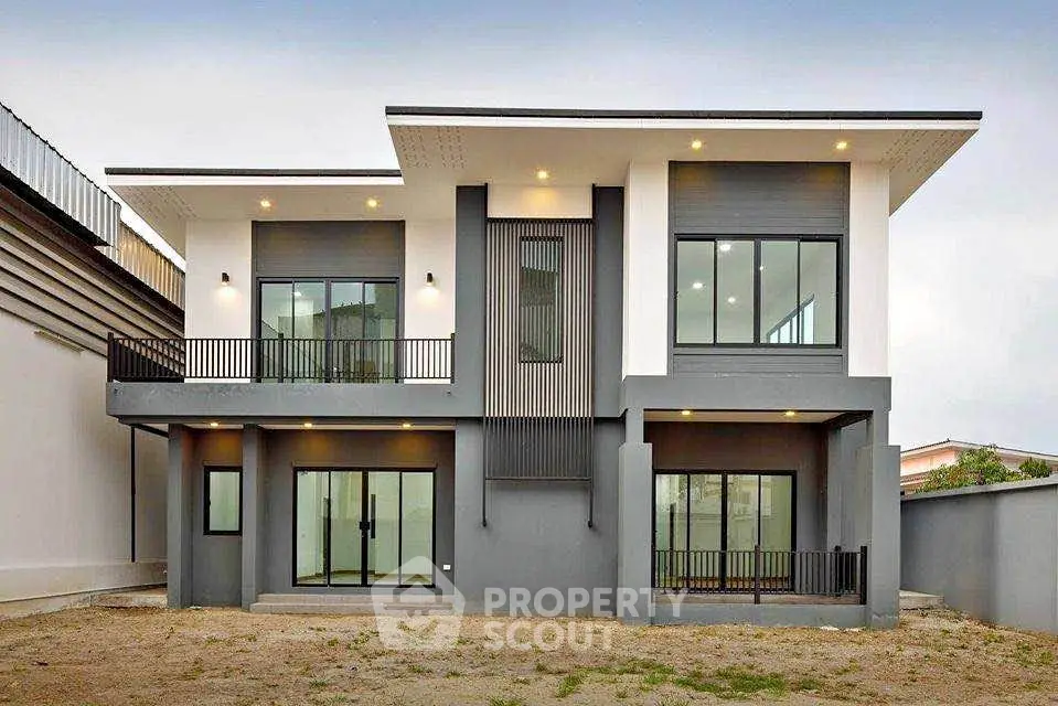 Modern two-story house with sleek design and large windows