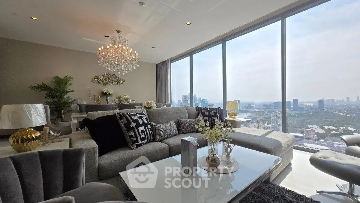 Luxurious living room with panoramic city view and elegant chandelier