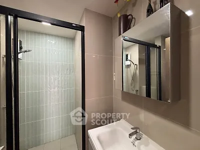 Modern bathroom with sleek shower and stylish vanity mirror